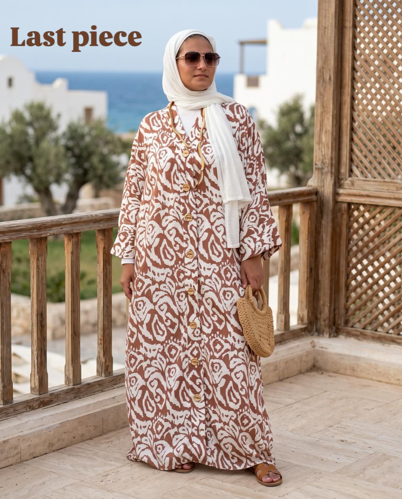 Off-white modest dress with simple design, suitable for daily wear.